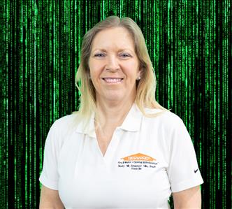 female employee with blond hair wearing a white SERVPRO shirt