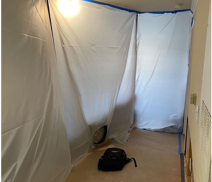 containment area setup in a home with mold damage