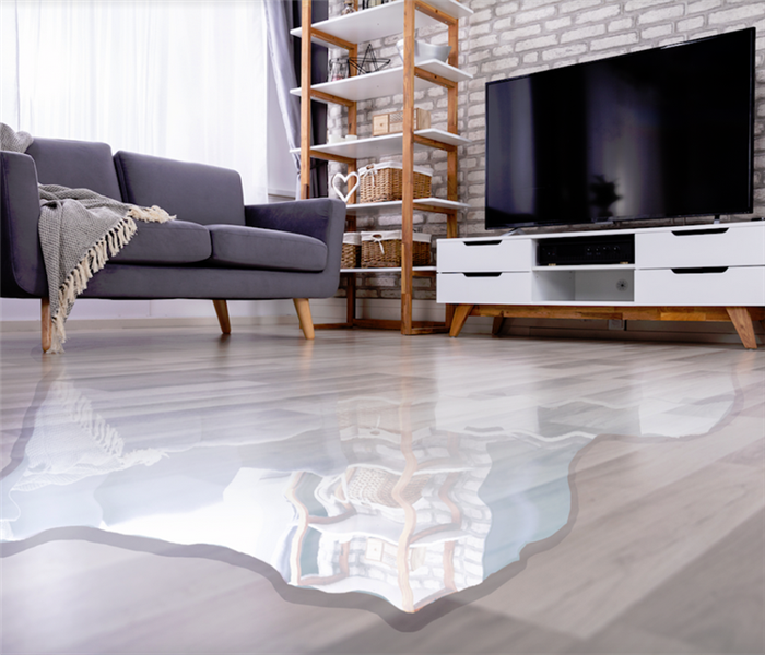 a flooded living room with water covering the floor